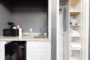 A compact kitchen with a microwave, coffee maker, and sink. - Private Studio In Boston's Bay Village! (Boston)