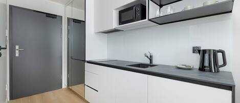 Fridge, microwave, stovetop, cookware/dishes/utensils