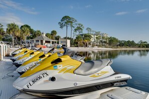 Jet skis line the dock, ready for a thrilling water adventure.