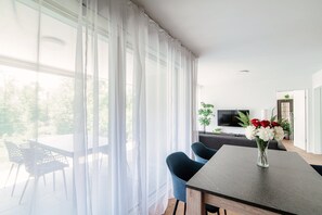 Design Apartment, Patio, Garden View | Living area | 32-inch flat-screen TV with satellite channels - Linda Terrace  (Locarno)
