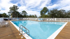 A rectangular pool with a wooden deck and white railings. - Pal306- Super Cute! Awesome Pool, & Beach Gear Included! Location X3! (Orange Beach)