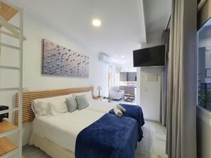 Double Apartment | Living area | Flat-screen TV