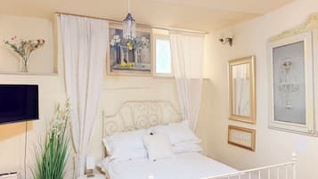 Studio | Living area | 50-inch plasma TV with satellite channels