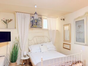 Studio | Living area | 50-inch plasma TV with satellite channels