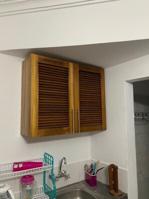 Fridge, microwave, cookware/dishes/utensils - Lux Suites Royal Palm Studio Apartment (Mtwapa)