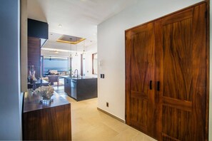 Elegant hallway with warm lighting and modern design accents - Amapas Oasis | Pool & Private BBQ (Puerto Vallarta)