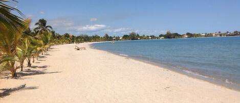 On the beach, sun loungers, beach towels