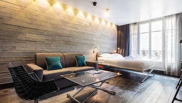 Studio, 1 Queen Bed with Sofa bed (61) | Living area | 60-inch TV with cable channels