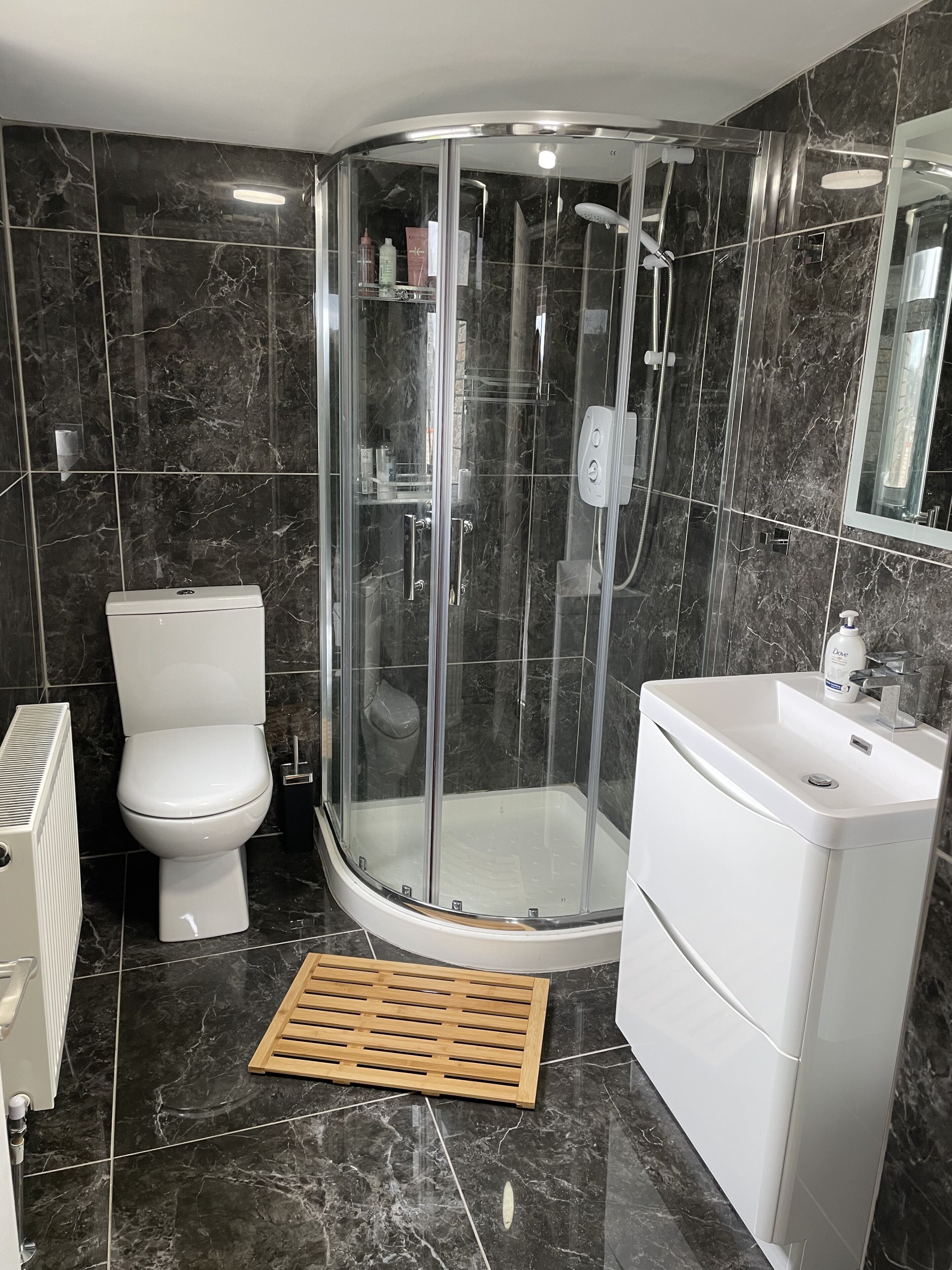 Shower, hair dryer, towels, soap
