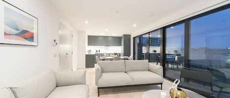 Two bedroom deluxe with balcony | Living area | Smart TV