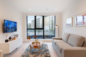 One Bedroom Standard | Premium bedding, desk, laptop workspace, iron/ironing board