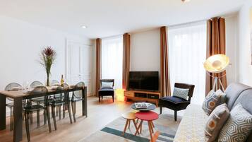 Premium Apartment | Living area | 127-cm Smart TV with cable channels, Netflix, MP3 dock