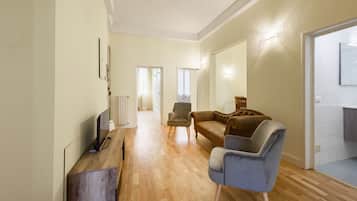 Comfort Apartment | Living area | 40-inch flat-screen TV with digital channels