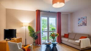 Comfort Apartment | Living area | Flat-screen TV