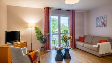 Comfort Apartment | Living area | Flat-screen TV