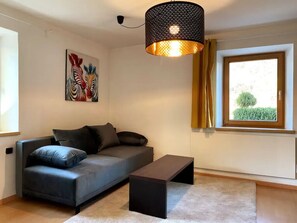 Apartment, 1 Double Bed with Sofa bed, Kitchen, Ground Floor | Living area | 55-inch Smart TV with satellite channels, Netflix, streaming services - Wohnen im Grünen (Innsbruck)