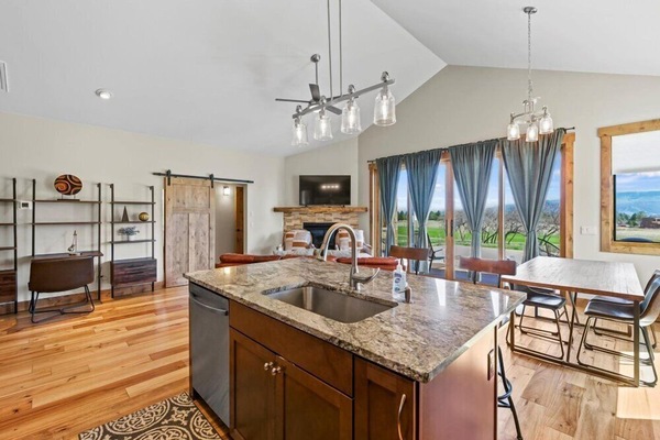 Open-concept living room with cozy seating and panoramic views.