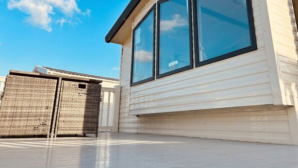 A single-story building with large windows and a flat roof. - Prime Lakeside Caravan at Haven Golden Sands (Mablethorpe)