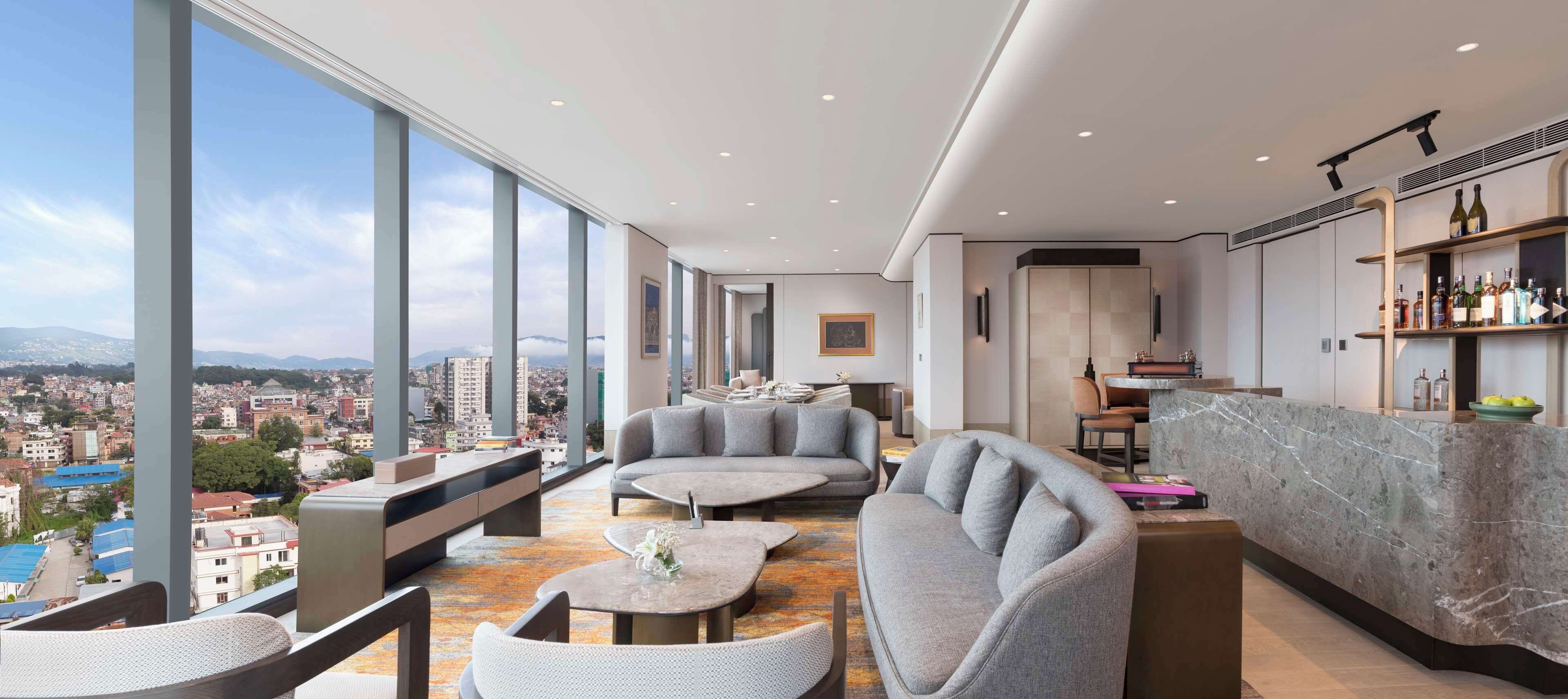 Presidential Suite, 1 King Bed | Living area | 55-inch LED TV with cable channels, books