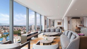 Presidential Suite, 1 King Bed | Living area | 55-inch LED TV with cable channels, books - Hilton Kathmandu (Kathmandu)