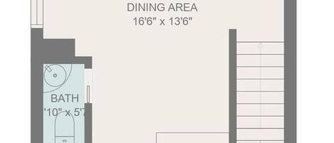 A floor plan of a hotel room with a living room, dining area, kitchen, and bathroom.
