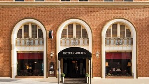 A brick building with three arched windows and a sign reading "HOTEL CARLTON". - FOUND Hotel Carlton, Nob Hill (San Francisco)