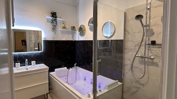 Jetted tub, hair dryer, towels, soap