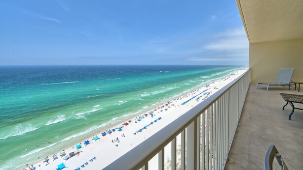 A balcony with a view of a beach and ocean. - Gulf Crest 2006- 20th Floor Living w/ Beach Service (Panama City Beach)