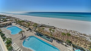 A resort with two swimming pools, a beach, and a clear view of the ocean. - Gulf Crest 606: Escape to a Cozy 2-Bedroom with Gulf Views! (Panama City Beach)