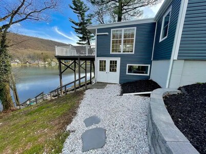 Lake Front Cottage with Fire Pit Terrace


