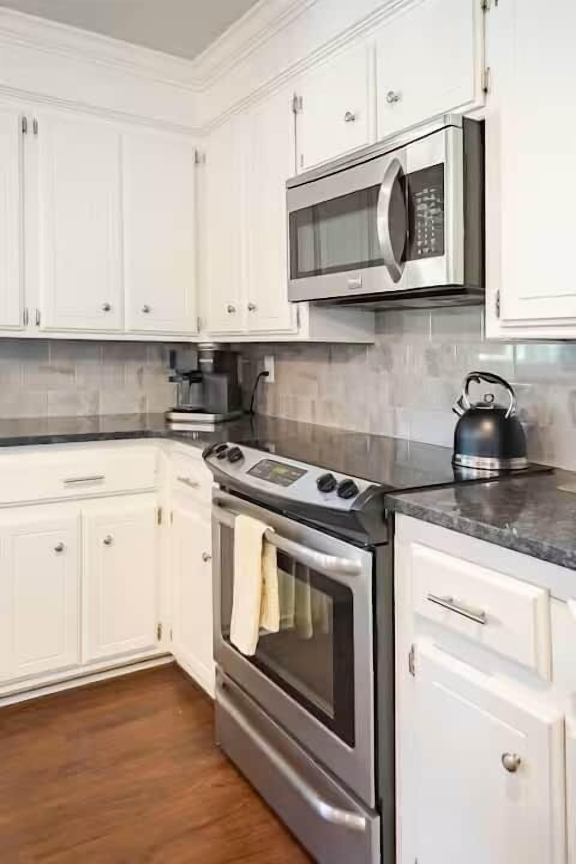 Fridge, coffee/tea maker, electric kettle, cookware/dishes/utensils