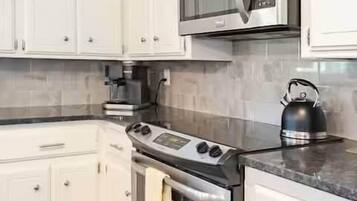 Fridge, coffee/tea maker, electric kettle, cookware/dishes/utensils