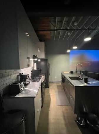 Fridge, microwave, oven, stovetop. Premier Loft Downtown Detroit