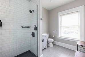Shower, hair dryer, towels, shampoo