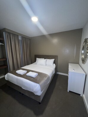 Executive Διαμέρισμα | 1 υπνοδωμάτιο, σίδερο/σιδερώστρα, δωρεάν Wi-Fi, κλινοσκεπάσματα 