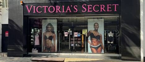Victoria's Secret store with large posters of models on the storefront.