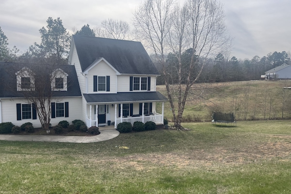4 Bedroom home sitting on 1.5 acres with the forest in the back.