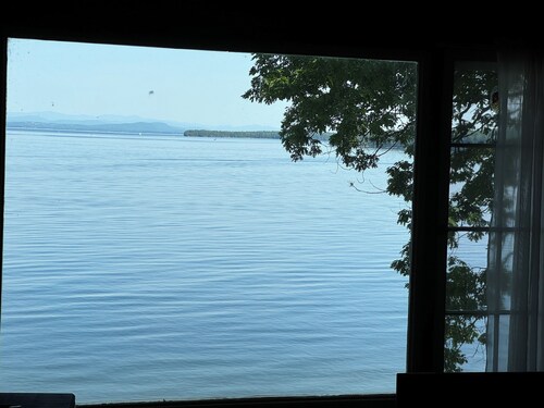 A New York camp on Lake Champlain, private pebble beach frontage.