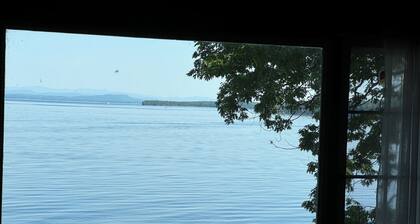 A New York camp on Lake Champlain, private pebble beach frontage.