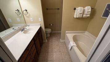 Shower, jetted bath, towels, soap