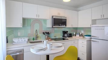 Suite, 1 King Bed, Kitchen | Private kitchen | Coffee/tea maker