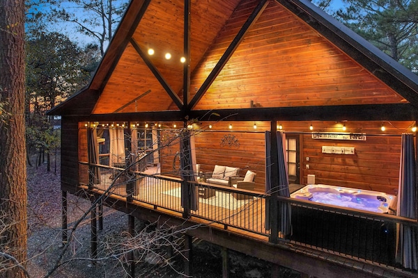 Private Hot Tub, fireplace, Porch Swing Bed, and plenty of seating in the back deck