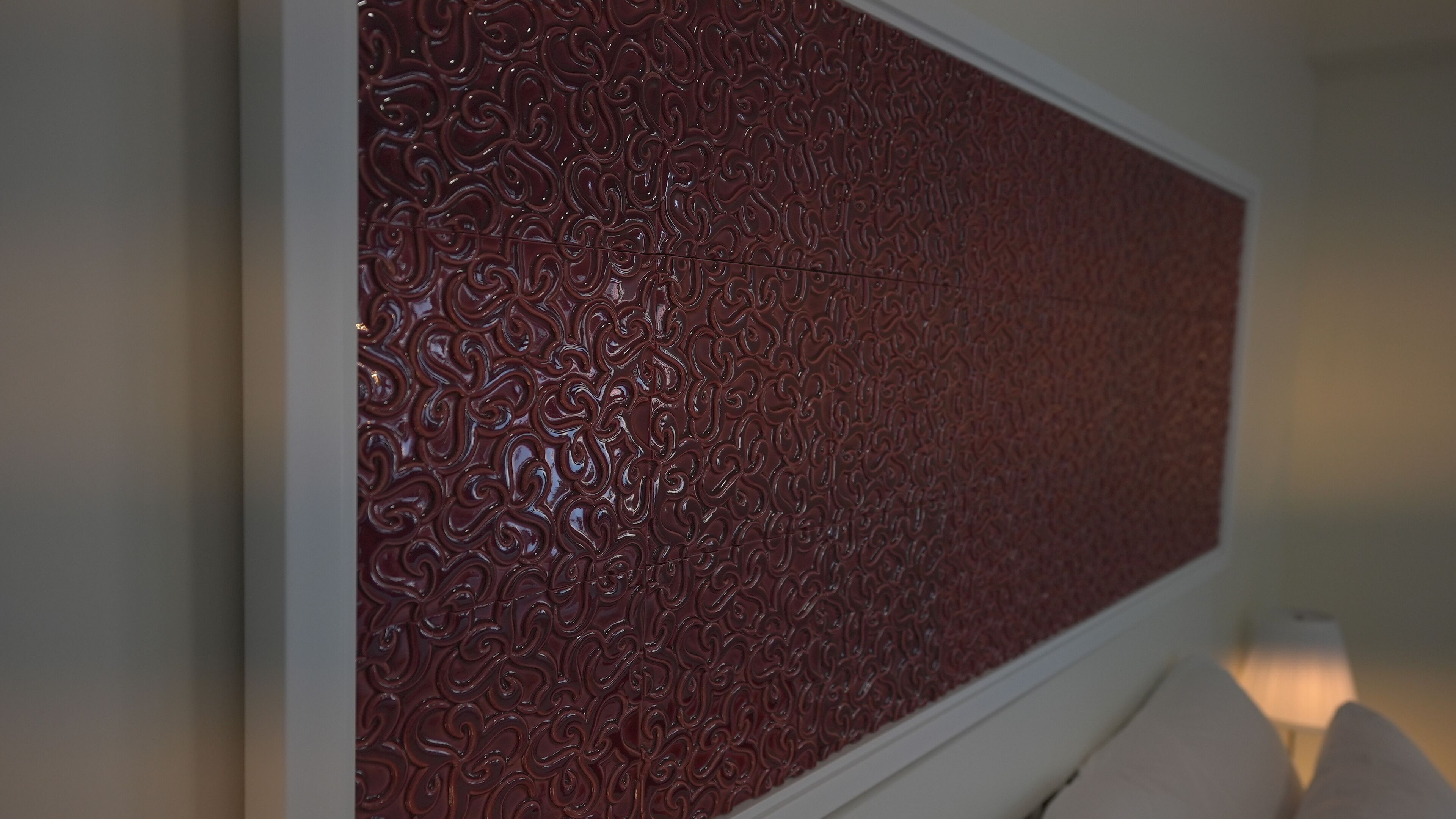A wall with a textured, patterned design.