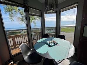 Enjoy ocean views from the room's large window and relax on the deck area.
