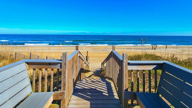 A wooden boardwalk leading to a beach with a clear view of the ocean. - Serenity-Too - Oceanside Relaxation, 6 Bed, 4.1 Bath, pool, hot tub, dog friendly! (Southern Shores)