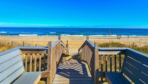A wooden boardwalk leading to a beach with a clear view of the ocean. - Serenity-Too - Oceanside Relaxation, 6 Bed, 4.1 Bath, pool, hot tub, dog friendly! (Southern Shores)