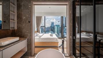 Deluxe Apartment, 3 Bedrooms, Balcony, City View | Bathroom | Shower, hydromassage showerhead, designer toiletries, hair dryer