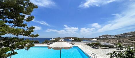 Outdoor pool, open 7:00 AM to midnight, pool umbrellas, pool loungers