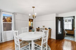 Enjoy meals in this dining room with a round table and four comfortable chairs.