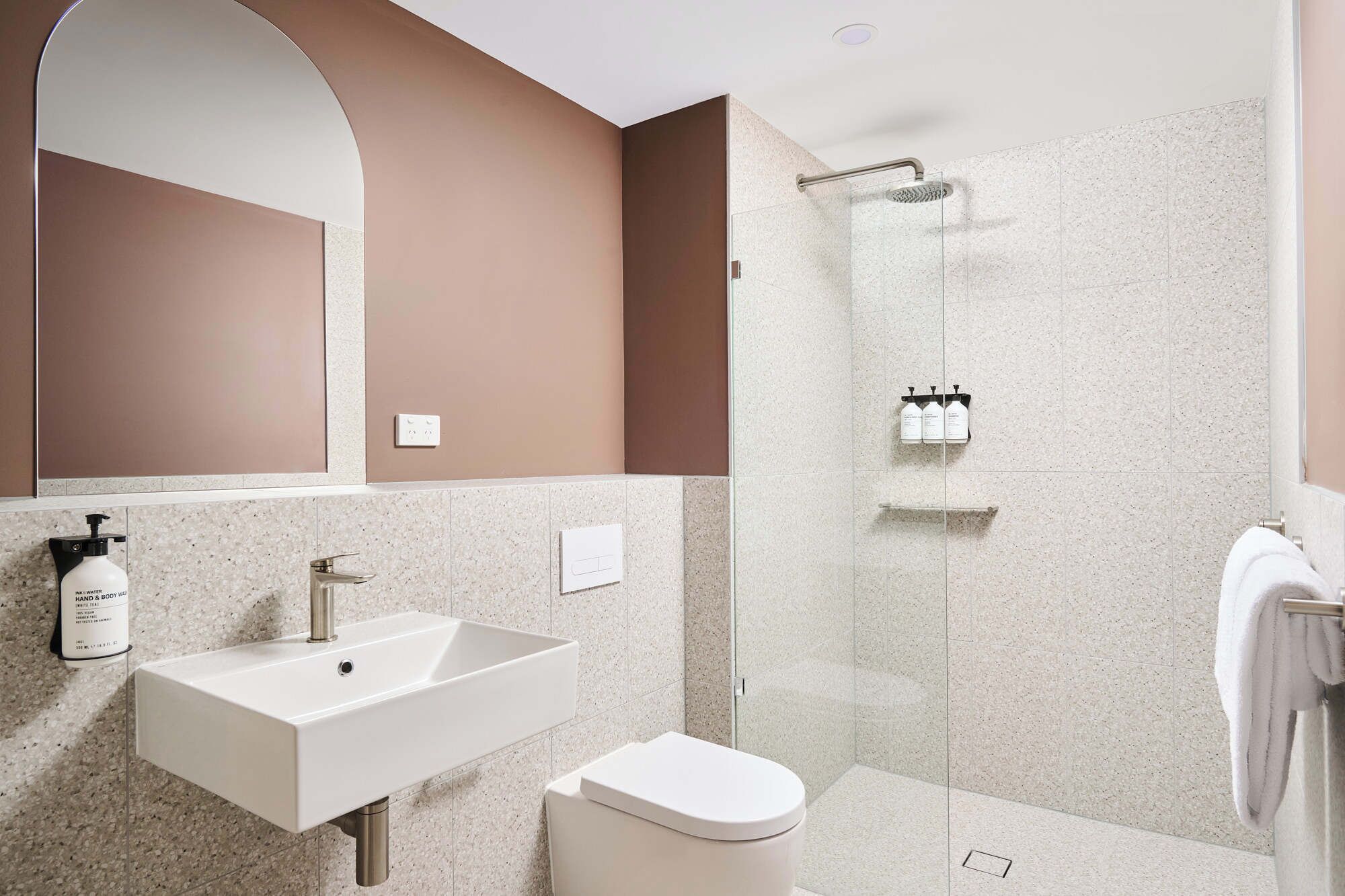 Shower, rainfall showerhead, hair dryer, towels